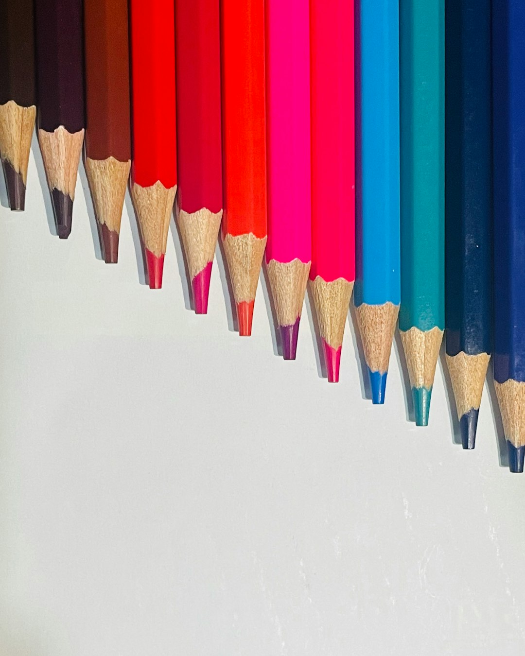 Photo by One Pixel a row of colored pencils lined up in a row